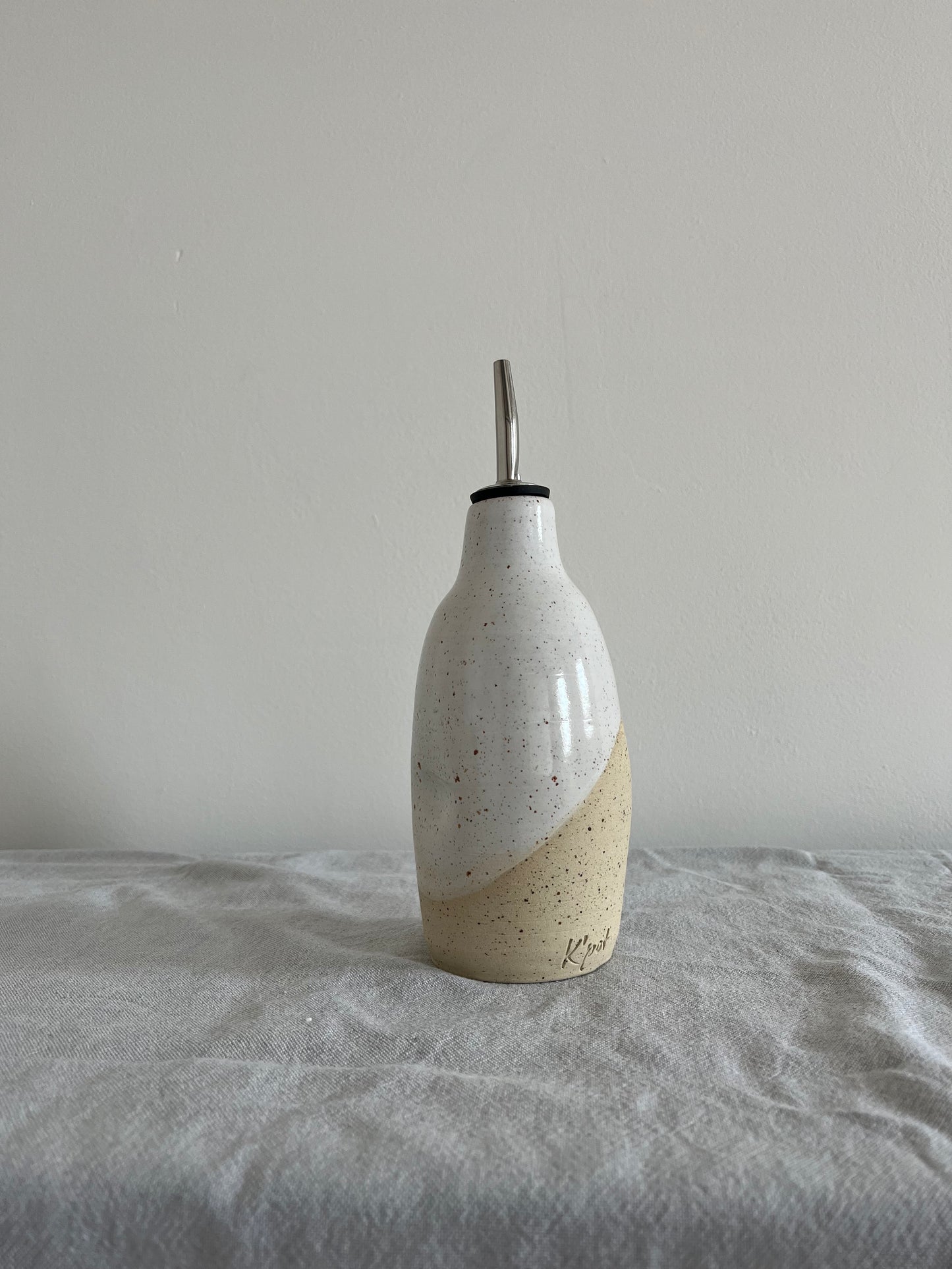 19. Oliefles - spikkel wit